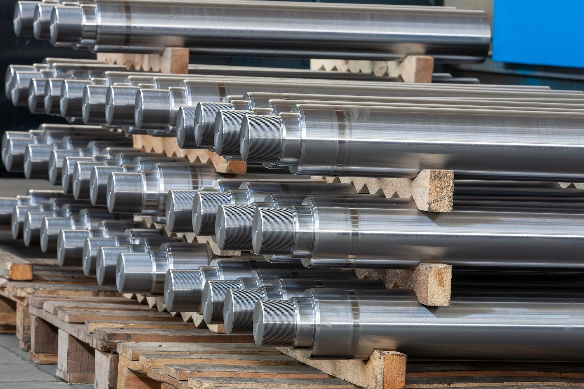 steel shafts stacked on pallets